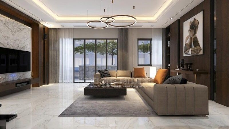 Mẫu trang trí nội thất phòng khách biệt thự cao cấp sử dụng phong cách trang trí nội thất hiện đại cùng cách trang trí đặc biệt khi sử dụng gỗ ốp tường vật liệu đòi hỏi năng lực thi công chuyên nghiệp cùng sự đầu tư không nhỏ từ khối đá đối vân, nền lớn đá.