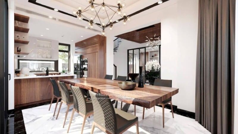 Ngoài điểm đặc biệt từ cách bố trí kệ trang trí, bàn đảo bằng đá nhân tạo màu trắng được thiết kế phô ra ngoài lại là điểm đáng chú ý, một mặt vẫn đảm bảo diện tích để chủ nhân có thể phô diễn món ăn thỏa mái, một mặt bạn lại có thể vừa nội trợ vừa có thể trông nom con học một cách dễ dàng.